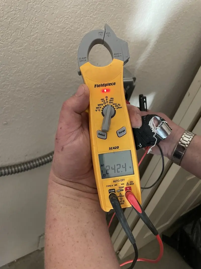 Voltage testing with clamp meter during Recessed Lighting Installation in Watervliet